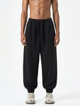 Essential-Drawstring-Jogged-Sweatpants-in-black-navy-womens-mens-unisex 