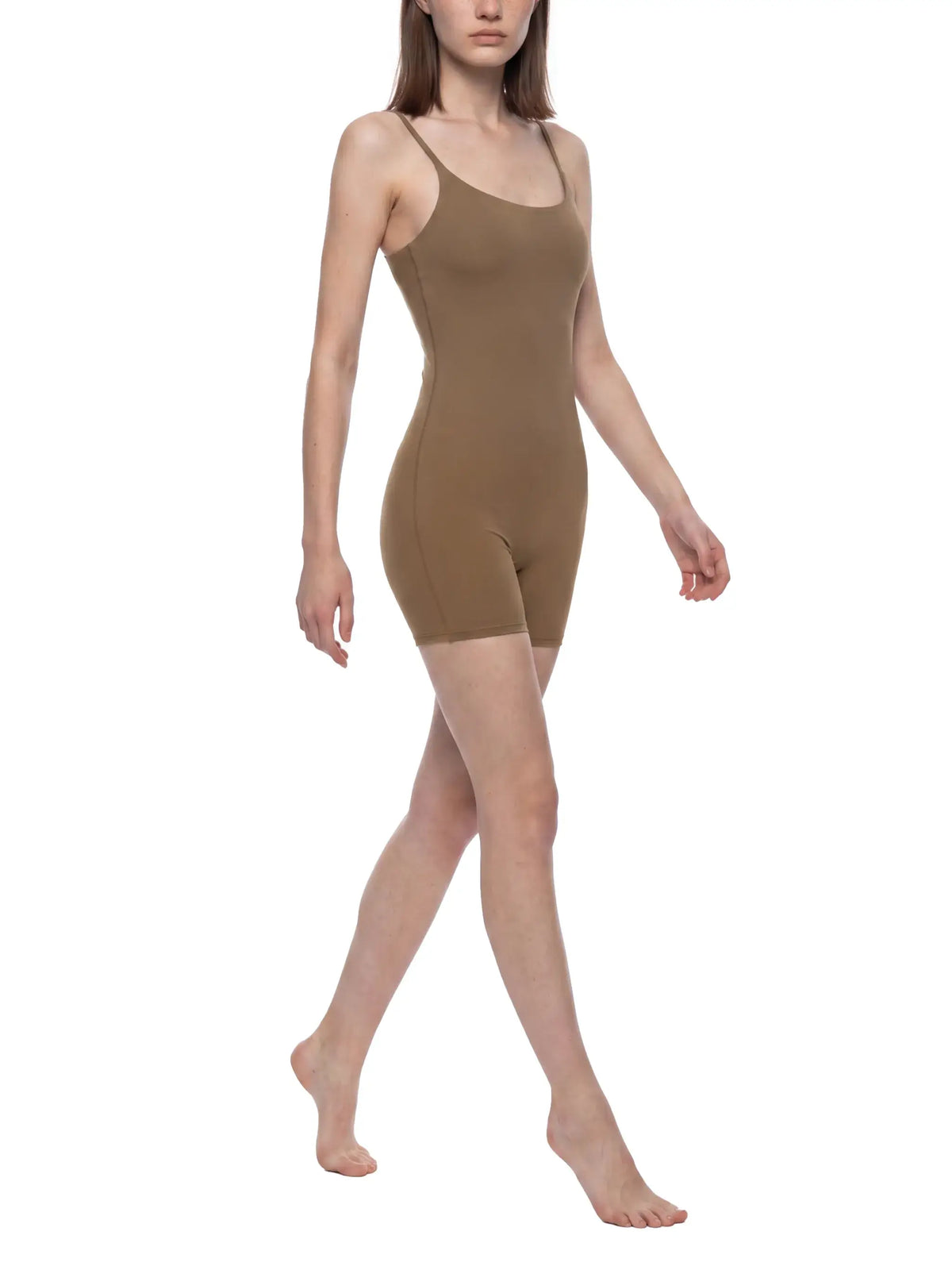 Woman modeling U-Neck Yoga Romper in a stylish brown color, perfect for yoga and activewear.